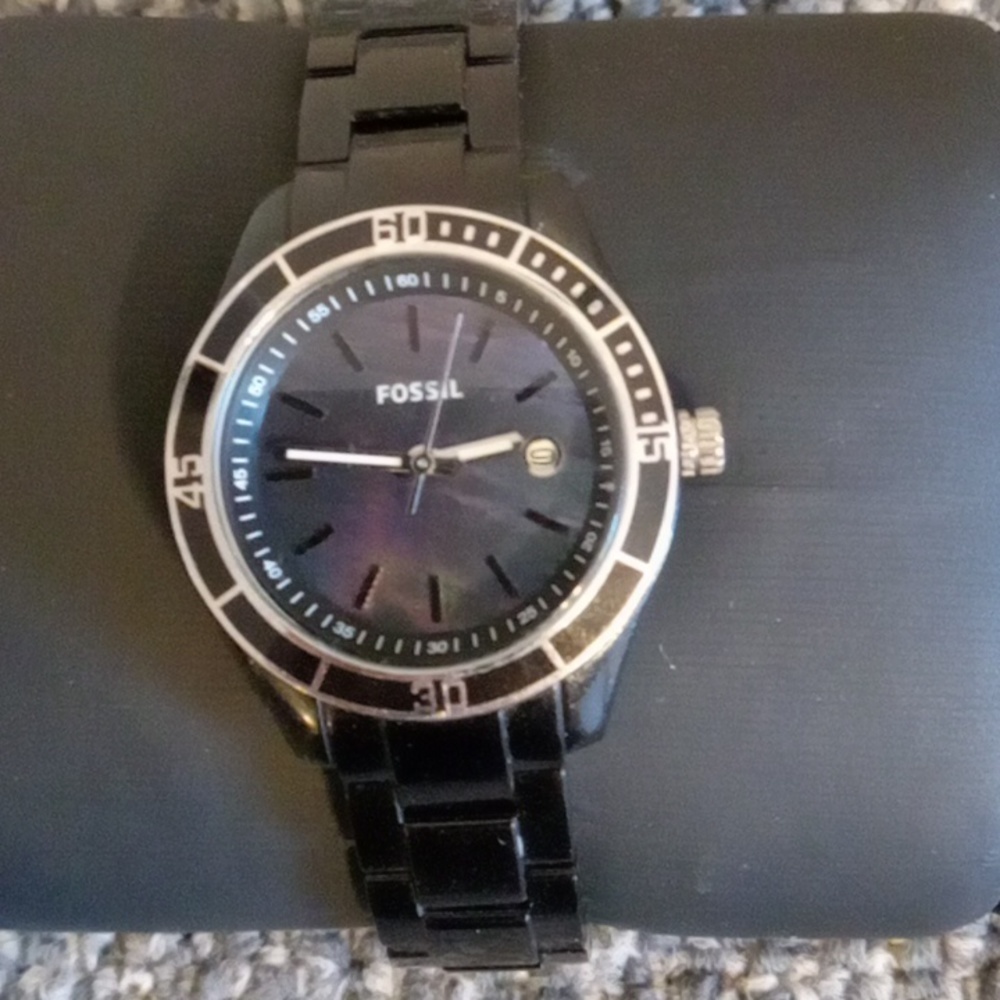 Fossil black acrylic stella purple iridescent face